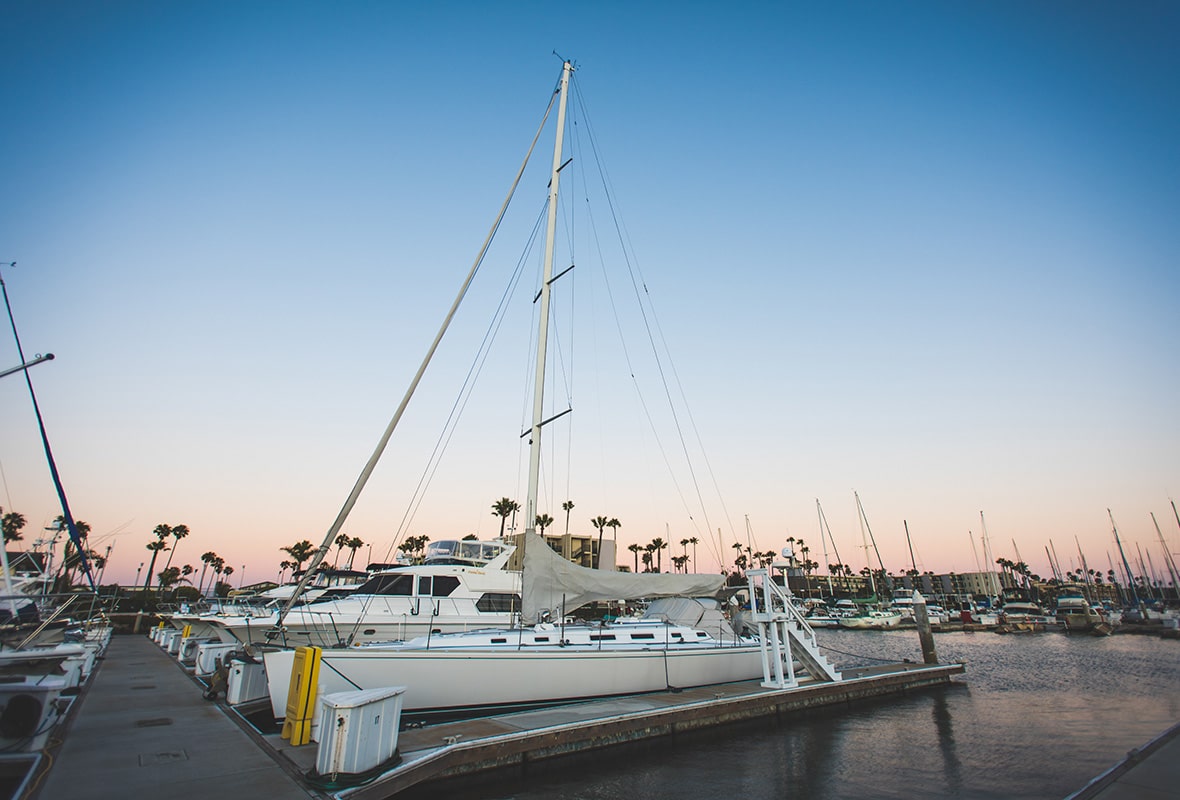 Boats docked at sunset