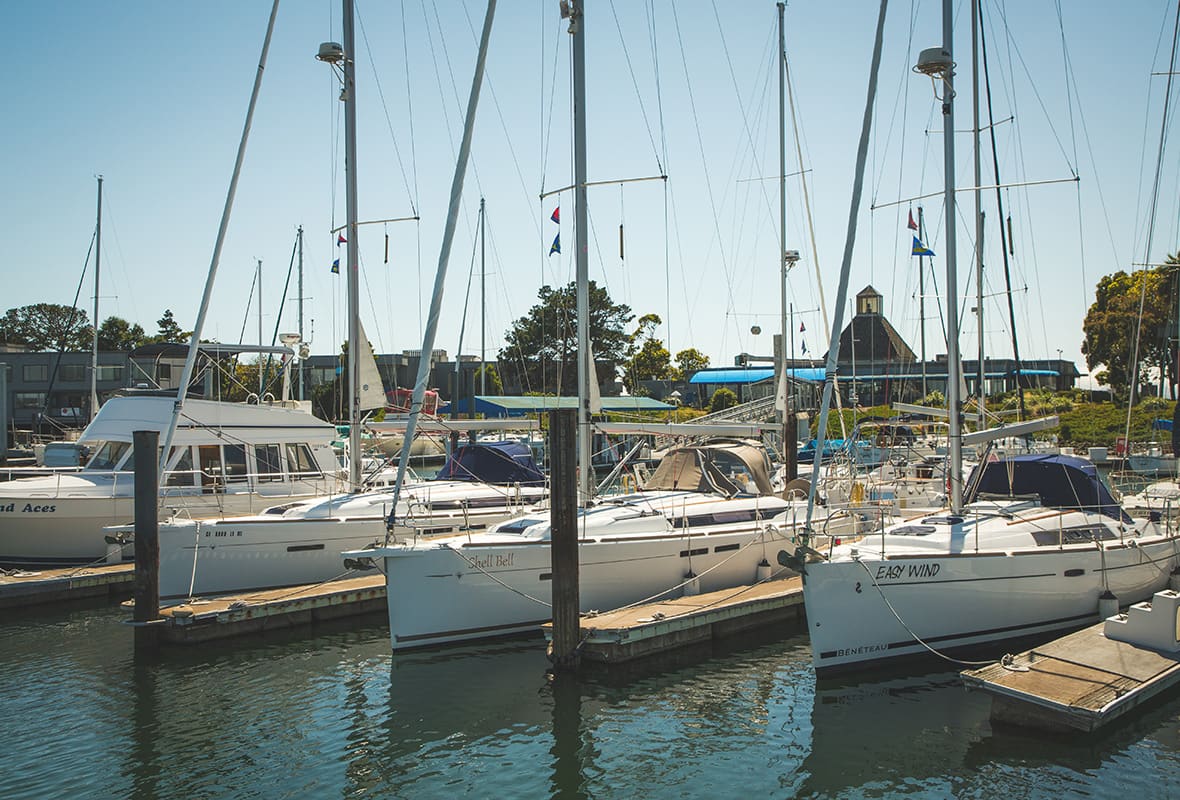 Boats docked at uncovered slips