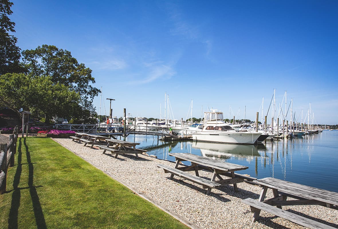 Picnic tables lining water